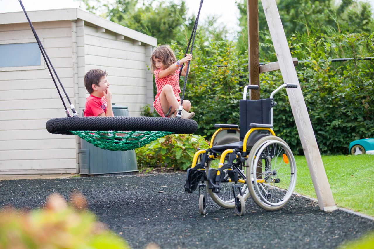 children playing in an adapted playground