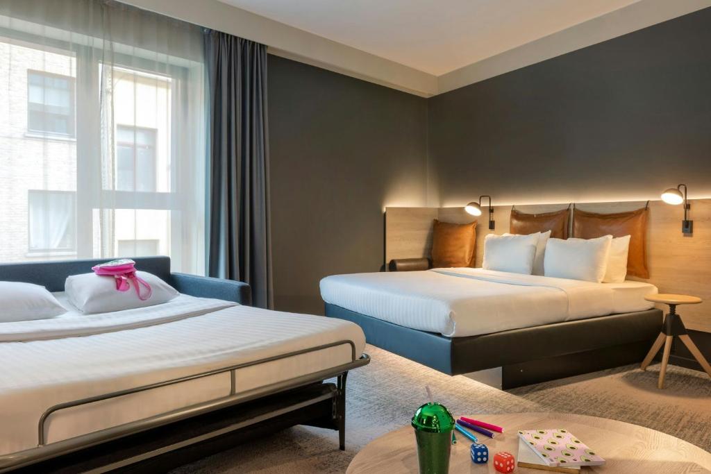 The family accessible room at the Moxy Hotel with double bed and and a double sofabed.